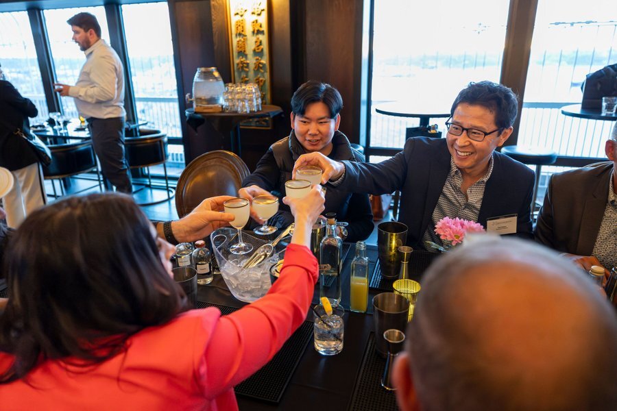 Members toasting at a cocktail class