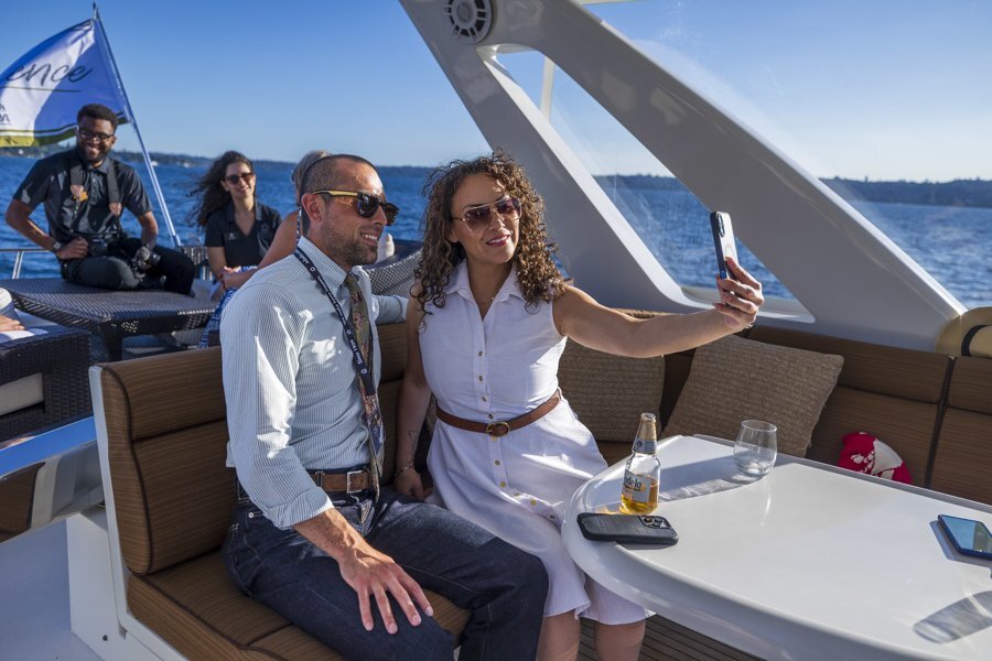 Members taking a selfie aboard a yacht